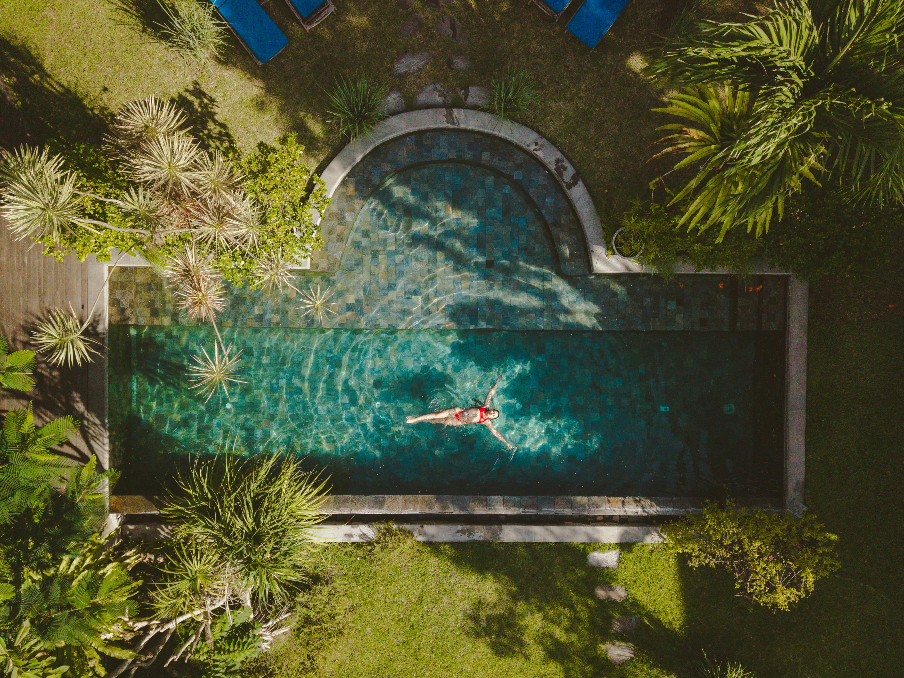 Aerial view of a luxury villa with infinity pool